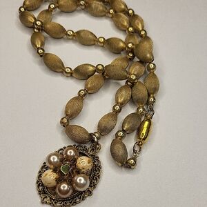 Elegant Gold Beaded Necklace with Floral Pendant